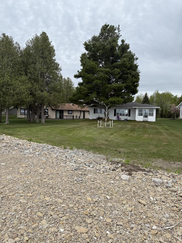 1253 N Partridge Point Rd, Alpena, MI 49707 - single story home featuring a front lawn