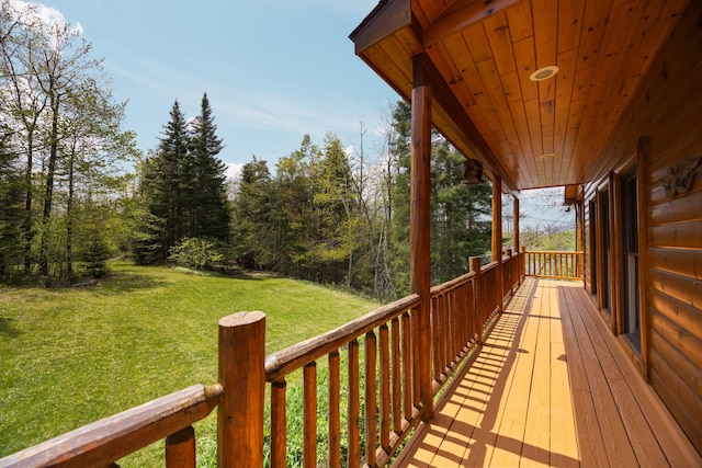 14250 Chippewa Trl, Johannesburg, MI 49751 - wooden deck featuring a lawn