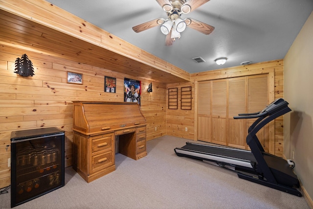 14250 Chippewa Trl, Johannesburg, MI 49751 - workout area with wooden walls, carpet, and ceiling fan
