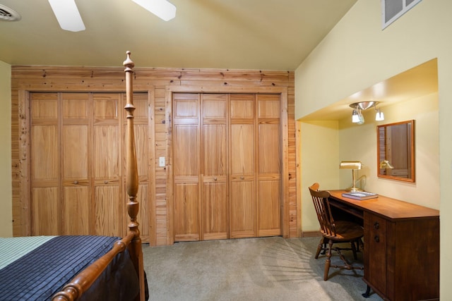 14250 Chippewa Trl, Johannesburg, MI 49751 - bedroom with wood walls, carpet floors, an office area, and ceiling fan