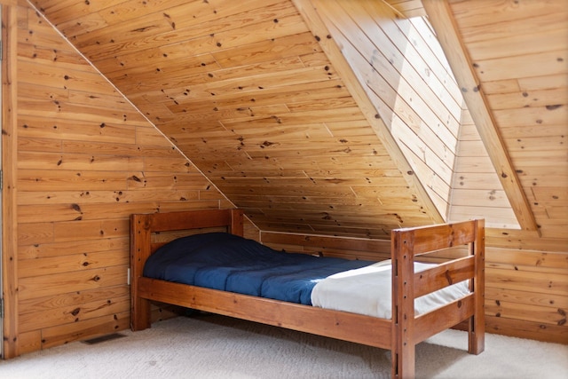 14250 Chippewa Trl, Johannesburg, MI 49751 - bedroom featuring lofted ceiling, carpet, wooden walls, and wood ceiling
