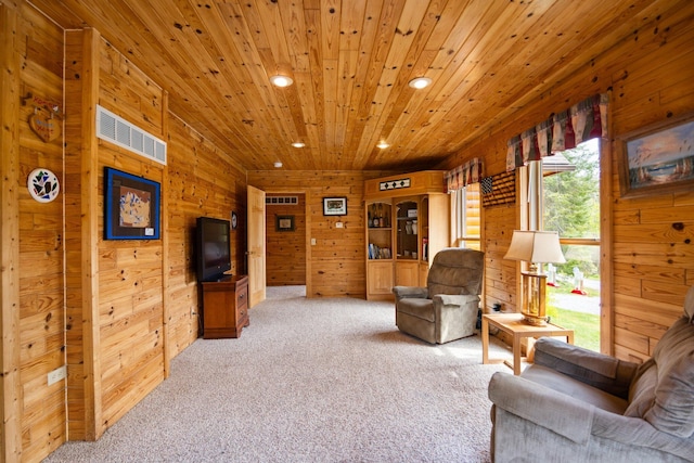 14250 Chippewa Trl, Johannesburg, MI 49751 - living room with recessed lighting, light carpet, wood walls, and wooden ceiling