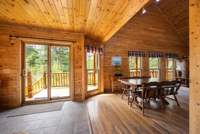 14250 Chippewa Trl, Johannesburg, MI 49751 - dining area with wood walls, vaulted ceiling, and wood ceiling