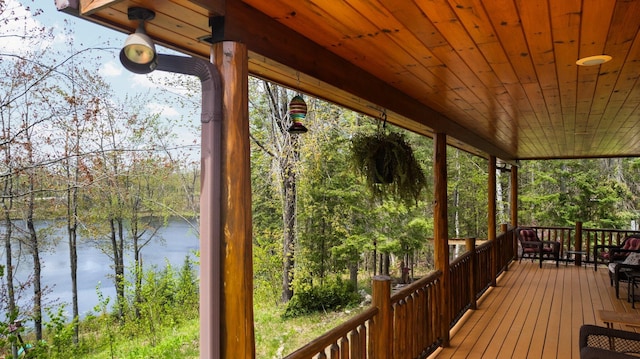 14250 Chippewa Trl, Johannesburg, MI 49751 - wooden deck with a water view