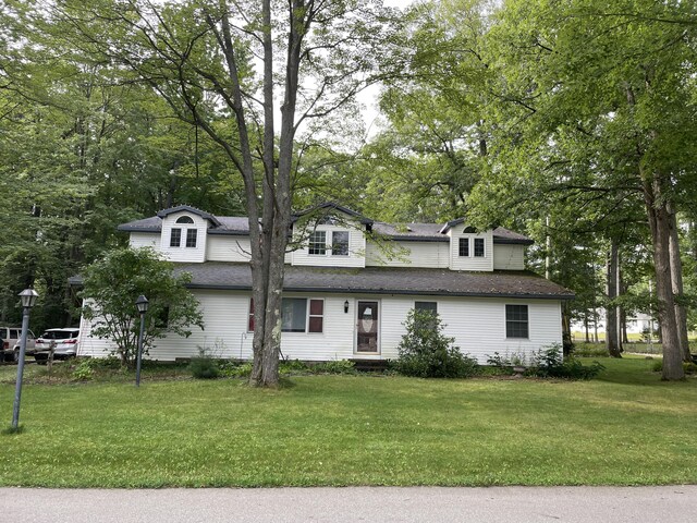 445 Noric Dr, Roscommon, MI 48653 - view of front of property with a front yard and a shingled roof