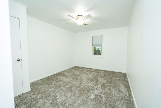 206 Harvey Ave, Houghton Lake, MI 48629 - carpeted empty room featuring a ceiling fan and baseboards