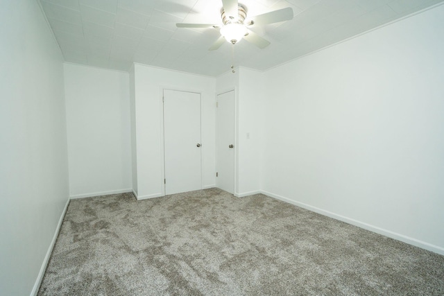 206 Harvey Ave, Houghton Lake, MI 48629 - carpeted spare room with ceiling fan and baseboards