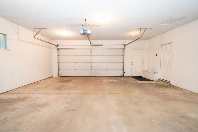 206 Harvey Ave, Houghton Lake, MI 48629 - garage featuring a garage door opener