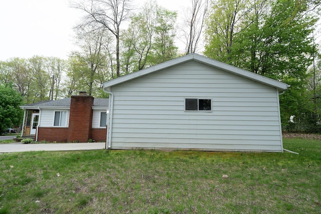 206 Harvey Ave, Houghton Lake, MI 48629 - view of side of property featuring a lawn, a chimney, and view of scattered trees