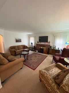 18598 Henry St, Melvindale, MI 48122 - carpeted living room featuring a fireplace