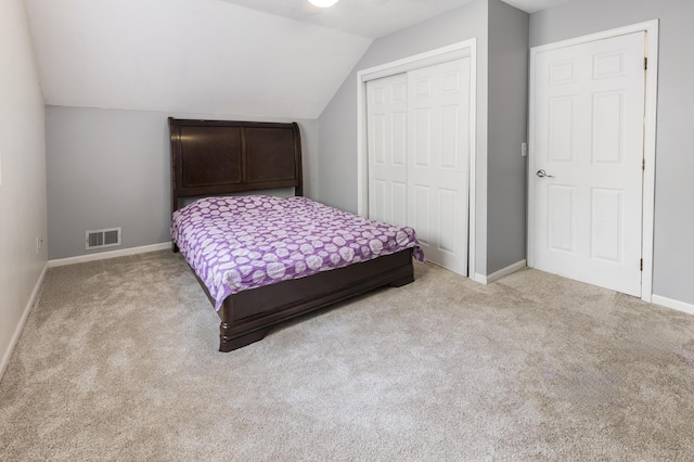 120 Seminole Trl, Roscommon, MI 48653 - carpeted bedroom with a closet, lofted ceiling, and baseboards