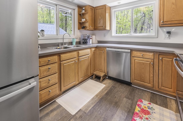 120 Seminole Trl, Roscommon, MI 48653 - kitchen featuring stainless steel appliances, a sink, dark wood-style floors, brown cabinetry, and open shelves