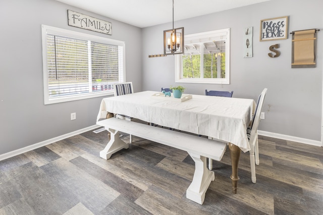120 Seminole Trl, Roscommon, MI 48653 - dining room featuring wood finished floors, a chandelier, and baseboards
