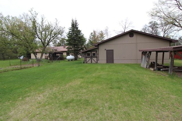 5432 E Michigan Hwy, Roscommon, MI 48653 - view of grassy yard featuring an outbuilding and an outdoor structure