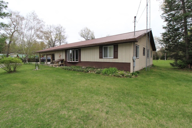 5432 E Michigan Hwy, Roscommon, MI 48653 - view of front of property featuring a front yard and metal roof