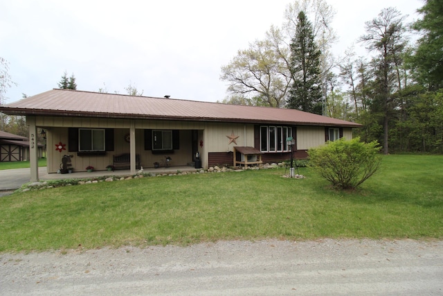 5432 E Michigan Hwy, Roscommon, MI 48653 - ranch-style home with a front yard, metal roof, a porch, and board and batten siding