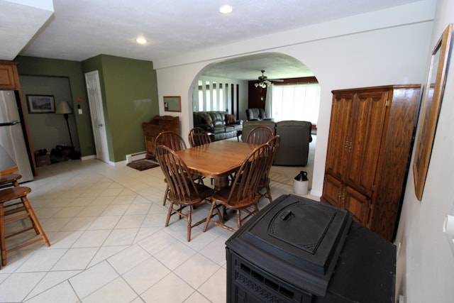 5432 E Michigan Hwy, Roscommon, MI 48653 - dining space with arched walkways, ceiling fan, a baseboard heating unit, and recessed lighting