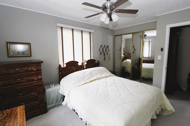 5432 E Michigan Hwy, Roscommon, MI 48653 - carpeted bedroom with ornamental molding, multiple windows, a closet, and a ceiling fan