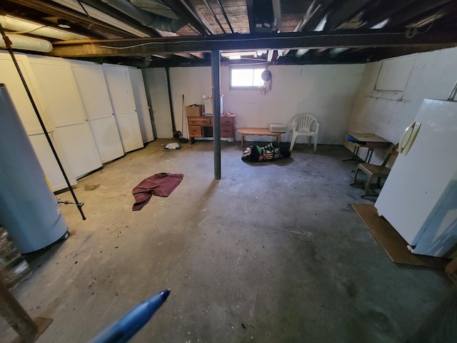 615 W Lake St, Alpena, MI 49707 - below grade area with refrigerator