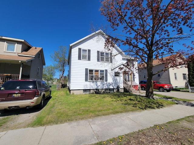 615 W Lake St, Alpena, MI 49707 - traditional-style house with a front yard