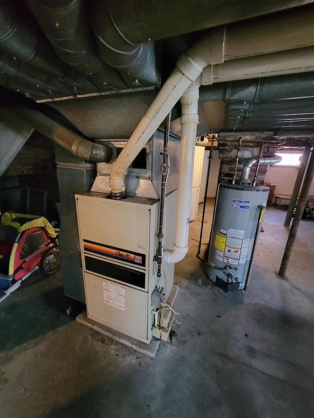 615 W Lake St, Alpena, MI 49707 - utility room featuring gas water heater and heating unit
