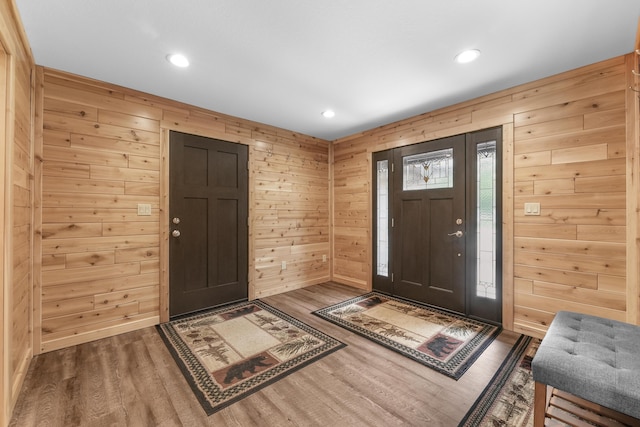 6801 Driftwood Cv, Saint Helen, MI 48656 - entrance foyer featuring wood finished floors, wooden walls, and recessed lighting