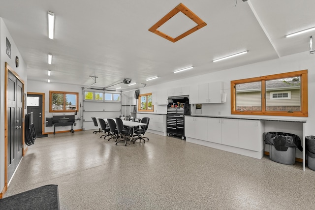 6801 Driftwood Cv, Saint Helen, MI 48656 - dining area featuring dark aggregate flooring