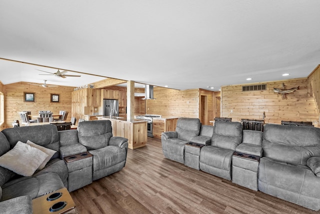 6801 Driftwood Cv, Saint Helen, MI 48656 - living area with wooden walls, wood finished floors, a ceiling fan, and recessed lighting