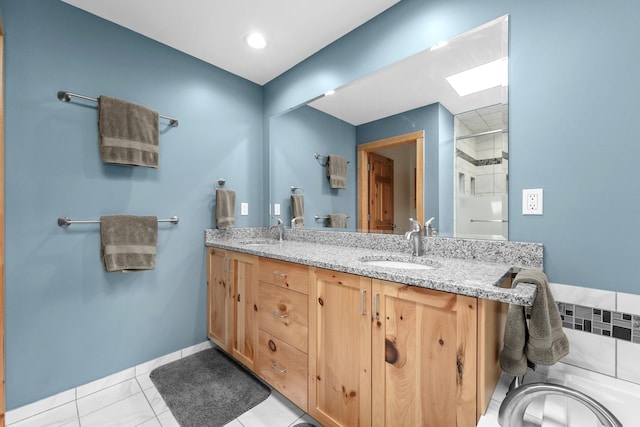 6801 Driftwood Cv, Saint Helen, MI 48656 - full bathroom featuring a skylight, double vanity, and a shower