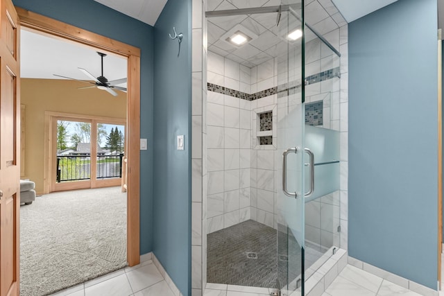 6801 Driftwood Cv, Saint Helen, MI 48656 - bathroom featuring baseboards, ceiling fan, and a stall shower