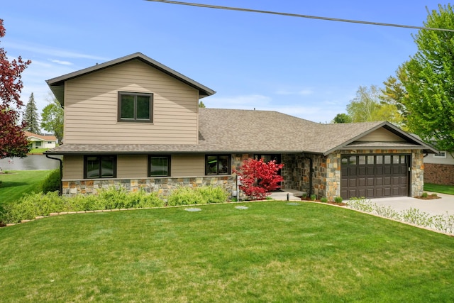 6801 Driftwood Cv, Saint Helen, MI 48656 - view of front facade featuring a garage, stone siding, driveway, and a front yard