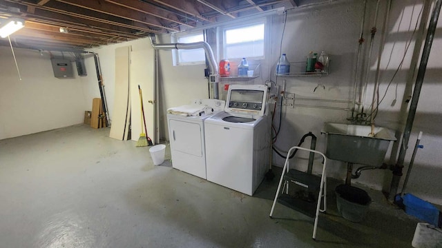 8619A Iowa St, Oscoda, MI 48750 - below grade area with electric panel, separate washer and dryer, and a sink