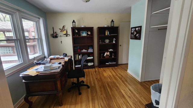 8619A Iowa St, Oscoda, MI 48750 - office featuring wood finished floors and baseboards