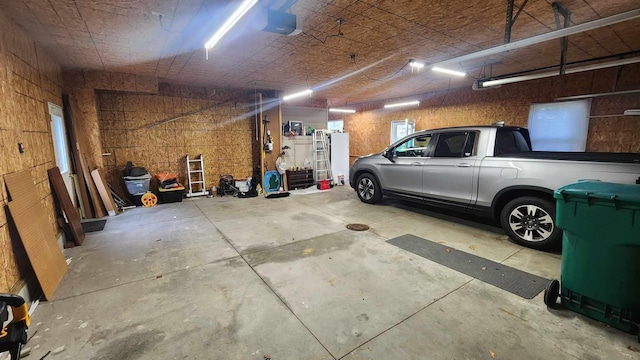 8619A Iowa St, Oscoda, MI 48750 - garage with a garage door opener