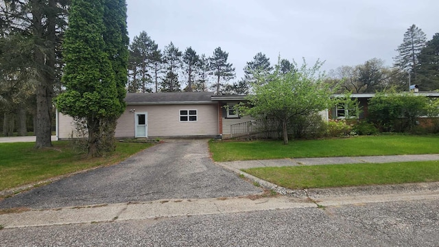 8619A Iowa St, Oscoda, MI 48750 - ranch-style house featuring a front yard and asphalt driveway