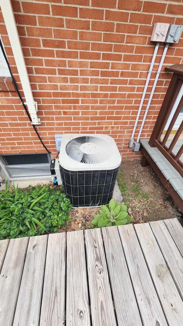 8619A Iowa St, Oscoda, MI 48750 - exterior view of central air condition unit and brick siding