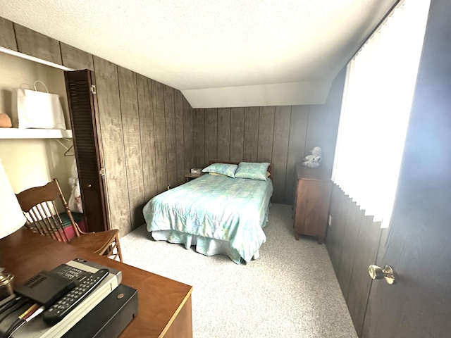 205 Beechwood Ave, Houghton Lake, MI 48629 - bedroom featuring wooden walls and light colored carpet