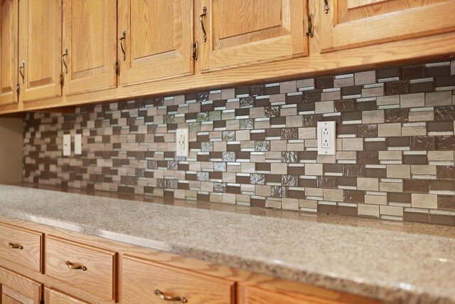 4285 Tower Hill Rd, Houghton Lake, MI 48629 - detailed view of backsplash and light stone counters