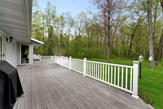 4285 Tower Hill Rd, Houghton Lake, MI 48629 - wooden terrace featuring a lawn and area for grilling