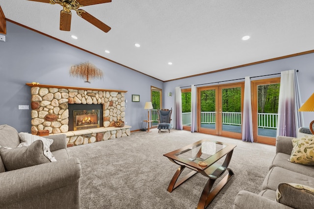 4285 Tower Hill Rd, Houghton Lake, MI 48629 - carpeted living room with vaulted ceiling, ornamental molding, a ceiling fan, recessed lighting, and a fireplace