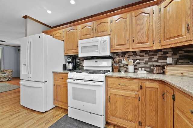 4285 Tower Hill Rd, Houghton Lake, MI 48629 - kitchen featuring white appliances, decorative backsplash, light wood-style floors, recessed lighting, and ornamental molding