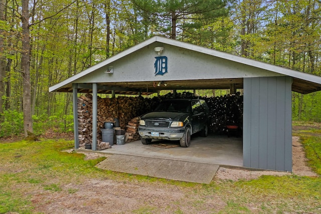 4285 Tower Hill Rd, Houghton Lake, MI 48629 - view of parking / parking lot with a carport and driveway