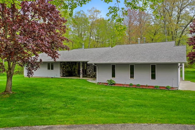 4285 Tower Hill Rd, Houghton Lake, MI 48629 - ranch-style home featuring a front lawn, a shingled roof, and a patio