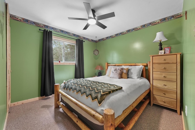 7028 Merrio Rd, Grayling, MI 49738 - bedroom featuring carpet flooring, baseboards, and ceiling fan