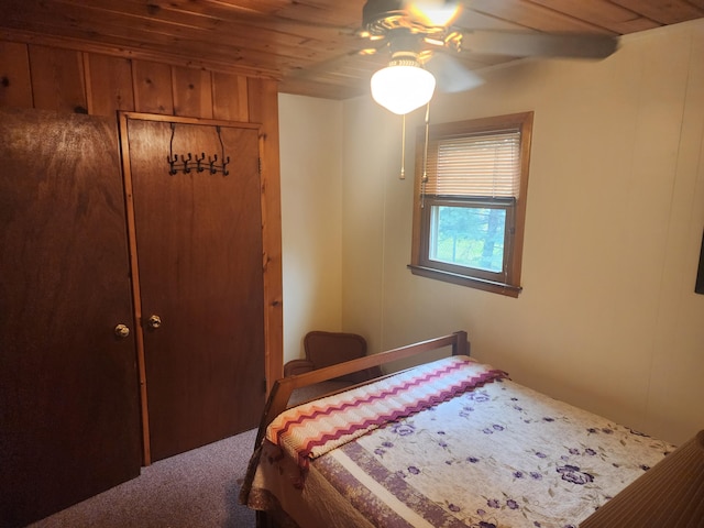 7305 Chain Lake Dr, South Branch, MI 48761 - bedroom with a closet, carpet flooring, a ceiling fan, and wood ceiling