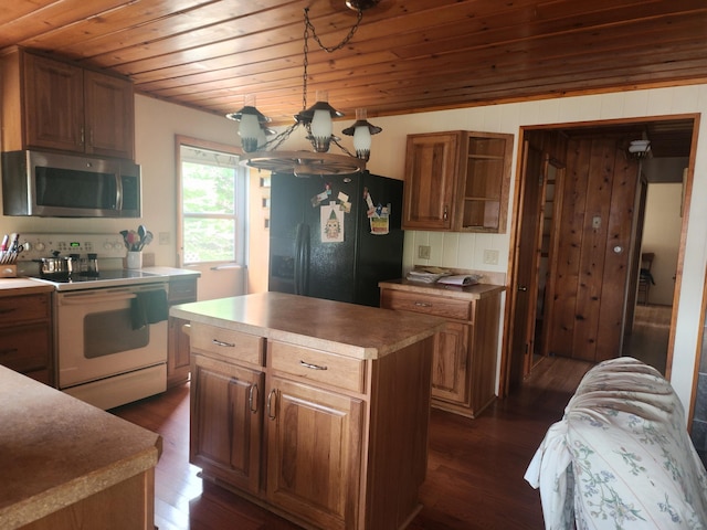 7305 Chain Lake Dr, South Branch, MI 48761 - kitchen with white electric range, stainless steel microwave, black fridge, dark wood-type flooring, and wood ceiling