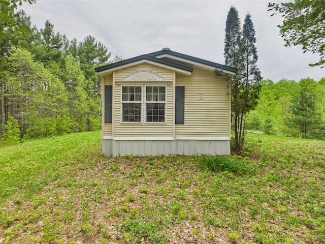 730 SE Cool Rd, Kalkaska, MI 49646 - view of side of home