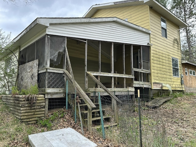 2883 M-18, Roscommon, MI 48653 - view of side of home with a sunroom