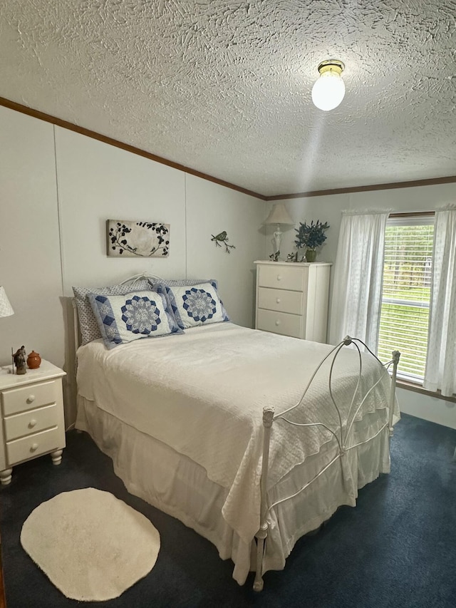 10162 Regimental Way, Grayling, MI 49738 - bedroom featuring crown molding, a textured ceiling, dark carpet, and vaulted ceiling