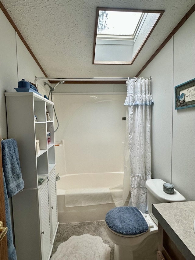 10162 Regimental Way, Grayling, MI 49738 - bathroom featuring lofted ceiling, a skylight, vanity, shower / bath combo with shower curtain, and toilet